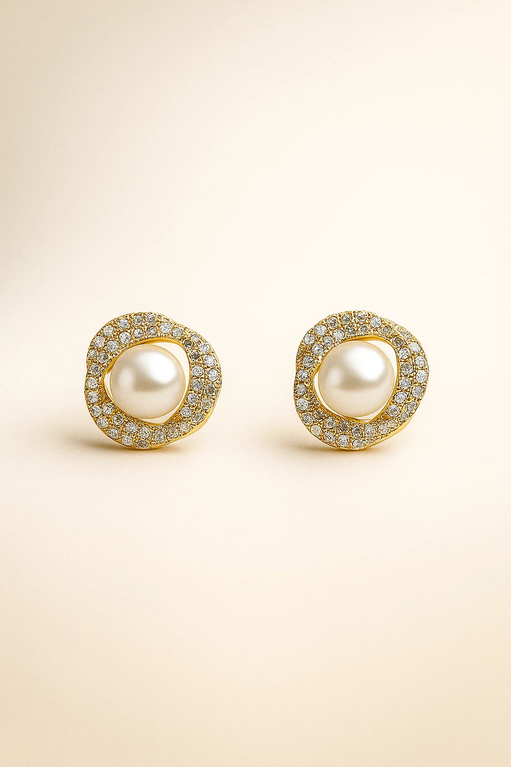 Gold swirl pearl stud earrings